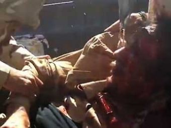 СМИ: повстанцы извращенно издевались над Каддафи перед его смертью