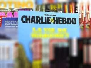 Charlie Hebdo показал обложку с Елизаветой II, душащей Меган Маркл